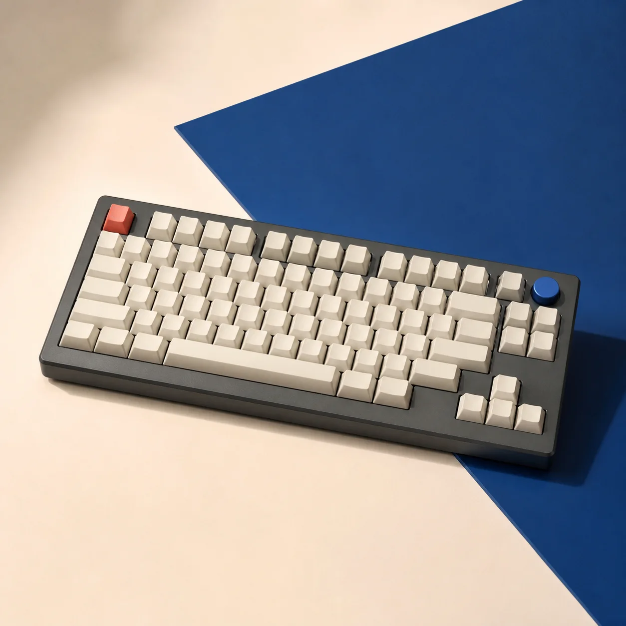 Graphite Aster TKL keyboard with a cobalt rotary knob